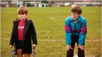  ?? BABY COW PRODUCTION­S ?? Oliver Savell (right) plays young Alan Carr in the sitcom written by the comedian himself and based on his childhood