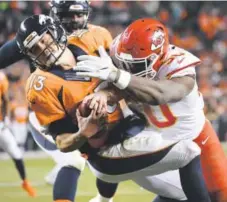  ?? Joe Amon, The Denver Post ?? The Chiefs’ Justin Houston sacks Broncos QB Trevor Siemian and forces a fumble on Sunday night last week.