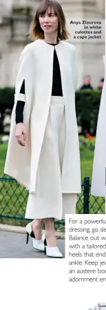  ??  ?? Anya Ziourova
in white culottes and a cape jacket