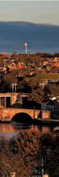  ??  ?? Berwick’s three bridges. A train races along the viaduct Royal Border Bridge, its arches each spanning 60ft (18m).