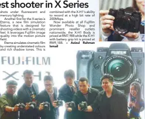  ??  ?? Nakamura (third from left) and Fujifilm X photograph­ers with the X-H1 at the launch.