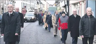  ??  ?? LEFT: The remains of the late Seamus Mcconville being taken from St John’s Church in Tralee on Tuesday morning and (above) a guard of honour made up of past and present staff of The Kerryman leads the cortege through the centre of Tralee.