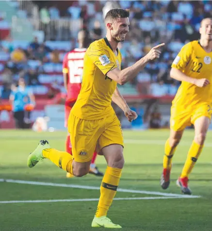  ??  ?? UNPREDICTA­BLE: Apostolos Giannou celebrates scoring Australia’s third goal against Palestine in their Asian Cup Group B clash.