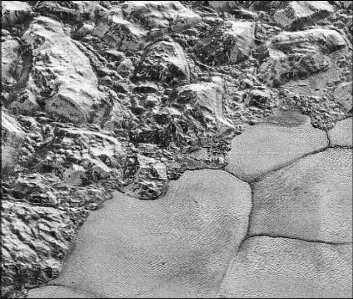  ?? The Associated Press ?? A July 2015 image made by the New Horizons spacecraft shows dunes, small ripples at bottom right, on Pluto’s Sputnik Planitia ice plain.