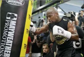  ?? JOHN LOCHER - THE ASSOCIATED PRESS ?? Floyd Mayweather Jr. trains at his gym while surrounded by media, Thursday, Aug. 10, 2017, in Las Vegas. Mayweather is scheduled to fight Conor McGregor on Aug. 26 in Las Vegas.