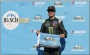  ?? MARY SCHWALM — THE ASSOCIATED PRESS ?? Kurt Busch smiles after winning the pole for the NASCAR Cup Series auto race Friday at New Hampshire Motor Speedway in Loudon, N.H.