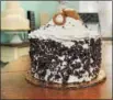  ?? GENE WALSH — DIGITAL FIRST MEDIA ?? A cannoli cake is on display at Lochel’s Bakery.