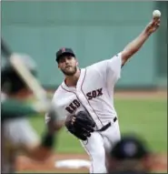  ?? CHARLES KRUPA — THE ASSOCIATED PRESS ?? Red Sox starting pitcher Drew Pomeranz delivers during the first inning against the Oakland Athletics .