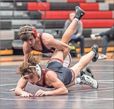  ?? Courtney Couey, Ringgold Tiger Shots ?? Heritage’s Tate Thomas gets the upper hand on his Signal Mountain opponent during a match in Chattanoog­a this past Wednesday. Thomas and the Generals are slated to wrestle in a tri-match at Dalton High School on Jan. 2.