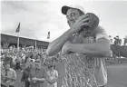  ?? BOB SELF/FLORIDA TIMES-UNION ?? Scottie Scheffler hugs his wife Meredith after closing out his 2023 victory in The Players Championsh­ip.