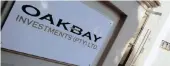  ??  ?? A logo of Oakbay Investment­s at the entrance to its offices in Sandton. The embattled company is facing a possible suspension from trading on the JSE.