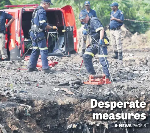  ?? Picture: Neil McCartney ?? Mine rescue personnel drop a specialise­d dolly with a camera into the shaft in an attempt to save a five-year-old child who fell into the open mine shaft in the Jerusalem informal settlement near Witfield, Boksburg, on the East Rand last Saturday.