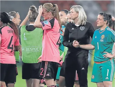  ?? Picture: PA. ?? Scotland players are consoled by manager Anna Signeul after the 6-0 defeat.