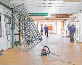  ?? Photo / Troy Baker ?? The clean-up at Riverslea Mall after Tuesday’s ram raid.