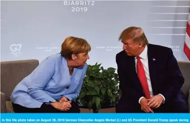  ??  ?? In this file photo taken on August 26, 2019 German Chancellor Angela Merkel (L) and US President Donald Trump speak during a bilateral meeting in Biarritz, south-west France. — AFP