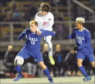  ?? Hearst Connecticu­t Media ?? Hall’s Evan Lombardo (10) and Greenwich’s Joao Pedro Lima (10) battle for a ball at midfield in the CIAC Class LL boys soccer state championsh­ip at Veterans Memorial Stadium on Nov. 23 in New Britain.