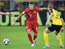  ??  ?? Bayern’s Benjamin Pavard (left) duels for the ball with Dortmund’s Jacob Bruun Larsen during the German Supercup final soccer match between Borussia Dortmund and Bayern Munich in Dortmund, Germany, on Saturday. AP PHOTO/MARTIN MEISSNER