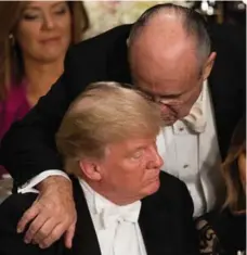  ?? DAMON WINTER/THE NEW YORK TIMES FILE PHOTO ?? Former N.Y. mayor Rudy Giuliani talks with Donald Trump at the Alfred E. Smith Memorial Foundation dinner at the Waldorf Astoria hotel last month, where Trump got a rough reception from New York’s elite.