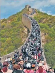  ?? AFP ?? People flock to the Great Wall of China in Beijing.