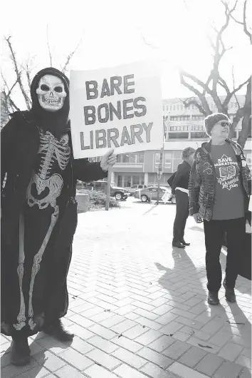  ?? MICHELLE BERG ?? Ruth Miller was among the concerned citizens rallying to close the book on restructur­ing the city’s libraries last month. The union that represents library employees says 20 positions were cut this year and proposed restructur­ing has been a concern....