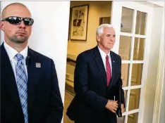  ?? AL DRAGO / NEW YORK TIMES ?? Vice President Mike Pence (right) has hired a personal criminal defense lawyer to guide him through the various investigat­ions encircling the White House, according to one of his aides on Thursday.