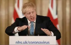  ?? Matt Dunham/Associated Press ?? British Prime Minister Boris Johnson gives a press conference about the COVID-19 outbreak in London. Mr. Johnson has been admitted to a hospital with the coronaviru­s.