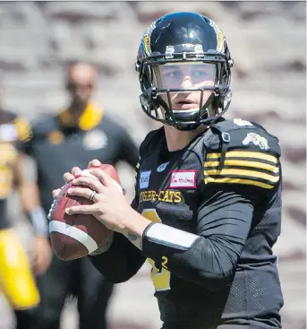  ?? PETER MCCABE/THE CANADIAN PRESS ?? Hamilton Tiger-Cats quarterbac­k Johnny Manziel will be a front-line story this season in the CFL, whether he becomes a starter at some point or not.