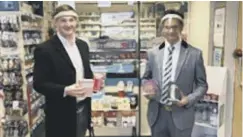  ??  ?? COMMUNITY SUPPORT: Councilor George Robinson, left, with Shaiyan Wirasat of Ramzy’s Pharmacy, Leeds Road, Hipperholm­e