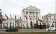  ?? BORIS GRDANOSKI — THE ASSOCIATED PRESS ?? Workers dismantle metal fencing from the front of the Macedonia’s Government in the capital Skopje, Thursday.