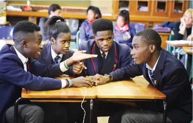  ?? PICTURE: DAVID RITCHIE ?? TEAMWORK: Jack Chima, Miriam Mavusi, Moses Ishimwe and Prince Mutomb of Maitland High School compete in the knock-out round of the Cape Argus Food Lover’s Market High Schools Quiz.