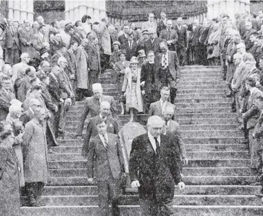  ?? PHOTO: STAFF PHOTOGRAPH­ER ?? Farewell . . . The funeral of James Ward at St Joseph’s Cathedral in Dunedin on February 8, 1962. His wife, Helen Ward, is pictured walking arm in arm with her son, Maurice Ward.