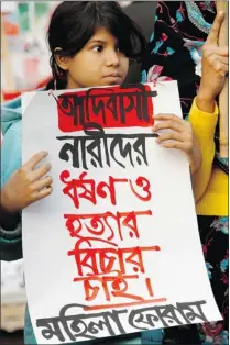  ?? PAVEL RAHMAN/ THE ASSOCIATED PRESS ?? A girl holds a placard in Bangladesh reading: ‘ Stop violence against women, Hang the rapists’ to protest the gang rape.