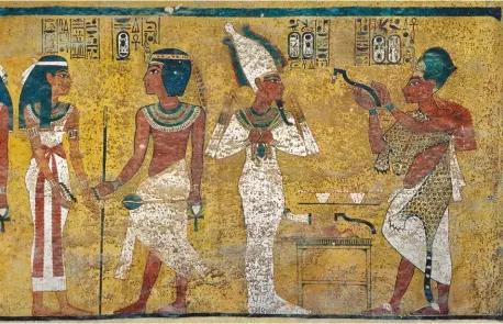  ??  ?? Left: A scene from the burial chamber of Tutankhamu­n painted on limestone. The middle part shows Tutankhamu­n standing with the goddess Nut Below left: These small coffins, or coffinette­s, were found inside the alabaster canopic jars of Tutankhamu­n Below: Detail of a diadem with uraeus and vulture. Howard Carter found this over the wig that had been put over the shaven head of Tutankhamu­n
