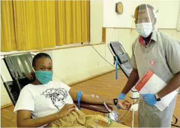  ?? Picture: SID PENNEY. ?? ANOTHER UNIT: Siphosethu Gwabeni (left) of Makhanda, who works in the LED and Planning division at Makana Municipali­ty, donated her 26th unit of blood when the SA National Blood Service (SANBS) paid a recent visit to the Dutch Reformed Church hall in Hill Street. She donated her first unit ten years ago while living in Mthatha. Assisting her on this occasion was profession­al nurse Phumelela Nyepa.