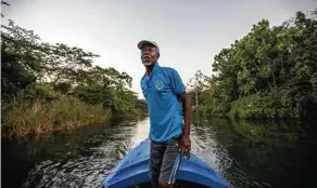  ?? David Goldman / Associated Press ?? Former spear fisherman Everton Simpson now works as a “coral gardener.”