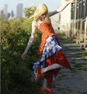  ??  ?? BRIGHT SPOT: A model walks the runway at Collina Strada Spring/ Summer 2022 show at the Brooklyn Grange rooftop garden.