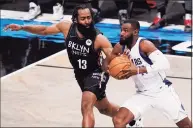  ?? John Minchillo / Associated Press ?? The Mavericks’ Tim Hardaway Jr., right, drives against Nets guard James Harden during the second half on Saturday.