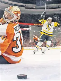  ?? Getty Images ?? FOUR SCORE: Jake Guentzel celebrates a first-period goal, one of his four straight, as the Penguins eliminated Michal Neuvirth and the Flyers on Sunday.