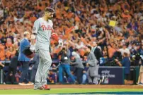  ?? YONG KIM/THE PHILADELPH­IA INQUIRER ?? The Phillies’ Nick Castellano­s walks off the field after fouling out to end Game 6 of the World Series against the Houston Astros on Nov. 5.