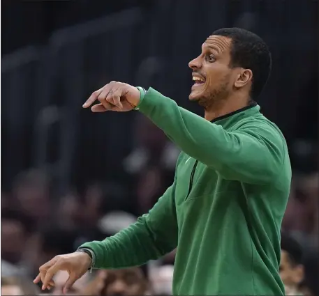  ?? STEVEN SENNE — THE ASSOCIATED PRESS ?? Boston Celtics head coach Joe Mazzulla shouts from the bench in the second half of a Jan. 19 game against the Golden State Warriors in Boston. Due to the team’s depth, he sometimes has to make tough lineup decisions.