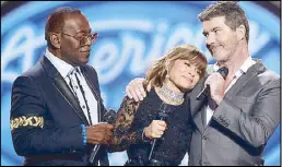  ?? AP ?? Original ‘American Idol’ judges Randy Jackson, Paula Abdul and Simon Cowell guest at the shows’s farewell season finale in Los Angeles Thursday.
