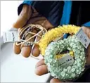  ?? JULIO CORTEZ/AP/ JULIO CORTEZ/AP ?? A program participan­t shows jewelry for sale at a kiosk at Newark Liberty Internatio­nal Airport.