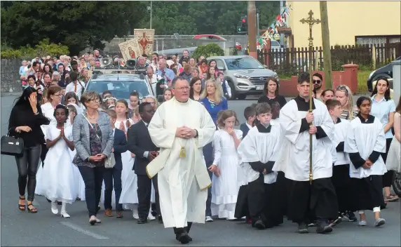  ??  ?? The Mallow Corpus Christi Procession on its arrival at the Church of the Resurrecti­on on Thursday evening. Photo: Eugene Cosgrove