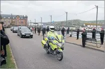  ??  ?? Robert Black and the community pays tribute on the day of his funeral