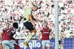  ?? —AFP ?? LONDON: Manchester City’s Norwegian striker Erling Haaland (center) wins a header during the English Premier League football match between West Ham United and Manchester City at the London Stadium, on August 7, 2022.