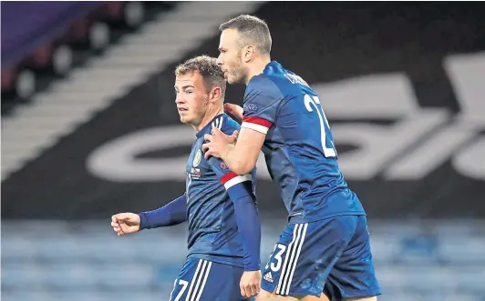  ??  ?? SUCCESS: Ryan Fraser, left, celebrates with team-mate Andrew Considine after scoring Scotland’s winner over the Czech Republic.