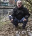  ??  ?? Cllr MacManus holds up rubbish along the Garavogue riverbank.