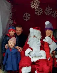  ??  ?? Ronan and Marissa visit Santa with their children Charlie and Belle – and their dog Cherry