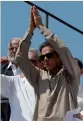  ?? — AFP ?? Pakistan Tehreek- e- Insaf chief Imran Khan gestures during the anti- government march in Islamabad on Monday.