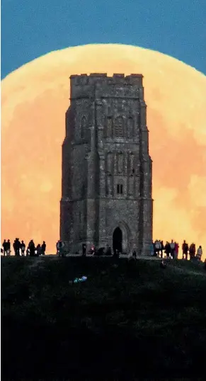 ?? MATT CARDY/GETTY IMAGES ?? The festival might now be a huge commercial affair, but Glastonbur­y is still a year-round magnet for those interested in spirituali­ty. St Michael’s Tower on Glastonbur­y Tor, is said to be the gateway to Avalon.
